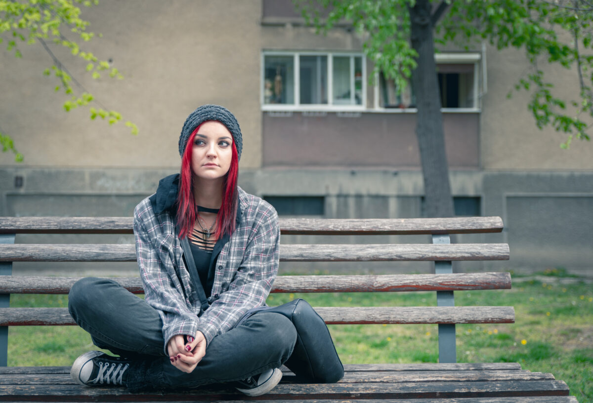 woman trafficking victim on park bench