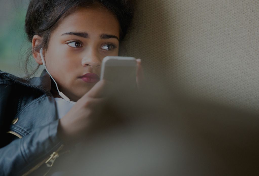 A young girl on her phone