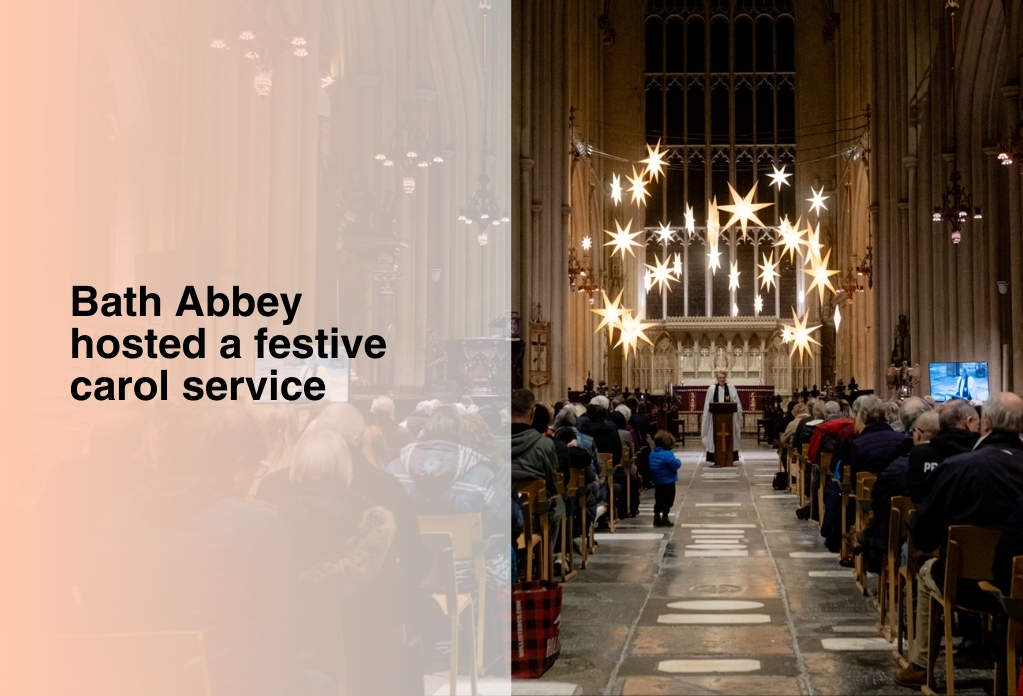 Picture of a Christmas Carol service at Bath Abbey. In the centre is the vicar delivering at speech. Above him, are lights in the shaped of stars. A huge crowd of people are seated in front of the vicar. On the right side of the image are the words "Bath Abbey hosted a festive carol service".